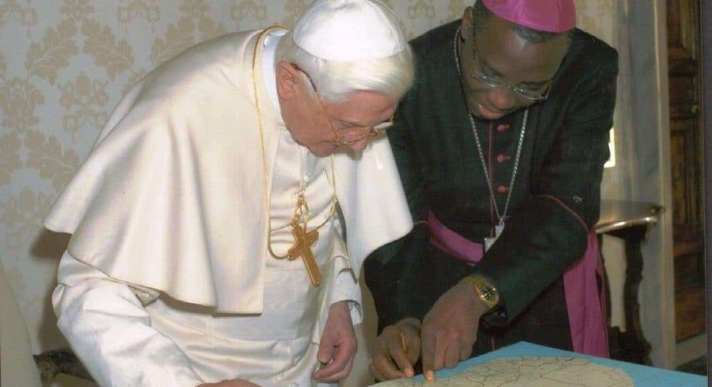 Bishop Augustine Ukwuoma Shwowing Pope Benedict XVI the map of Catholic Diocese of Orlu